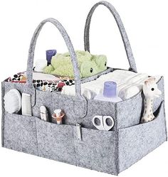 a gray bag with two stuffed animals in it and other items on the bottom shelf