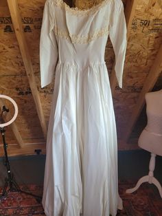 I have been conflicted posting this gown as a crafting piece. It is some beautiful fabric from 1948 and completely structurally sound. However, there are a couple of rusty stains on the back and the hem has some minor water staining. All of my bridal gowns must be wearable upon arrival and I'm not sure if this fabric is silk (it very well may be) so I can't guarantee that the stains will come out. But...there's a lot of beautiful, usable fabric here! The yield would be almost 4 yards (40" wide) just on the front skirt from side seam to side seam. Then the back and train would be a little more than that, but for the couple of stains and 3 seams. 34 perfect buttons + 4 that have a netting covering, used for the bustle. Also, there is 41" of wonderful sequined venise lace trim. So a bargain h Book Clothes, Very Well, Wedding Gown, Beautiful Fabric, Cut Off, Bridal Gowns, Lace Trim, Wedding Gowns, Knee Length