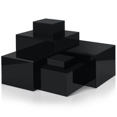 black cubes stacked on top of each other in the shape of an abstract structure