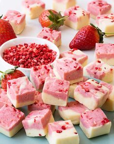 several different types of fudges and strawberries on a table