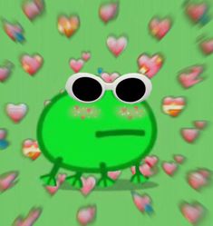 a green frog with heart shaped glasses on it's face