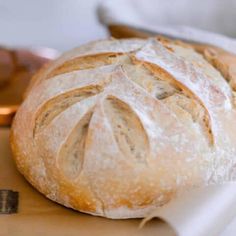 a loaf of bread sitting on top of a cutting board