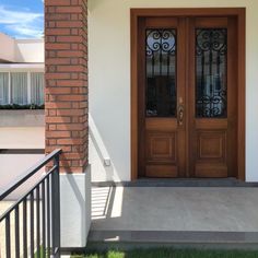 the front door of a house with two glass doors