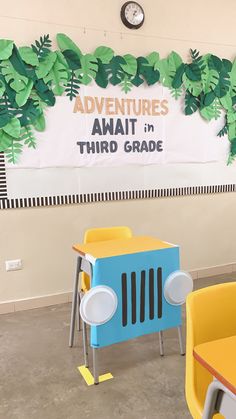 there is a sign that says adventures await in third grade on the wall behind two children's desks