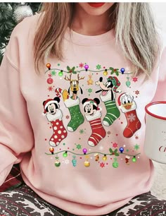 Disney Christmas Sweaters, Disney Christmas Holiday Tops, Disney Christmas Holiday Top, Christmas Disney Holiday Top, Disney Holiday Crew Neck T-shirt, Disney Crew Neck T-shirt For Holiday, Holiday Disney Crew Neck T-shirt, Disney Christmas Sweater, Disney Christmas Lights