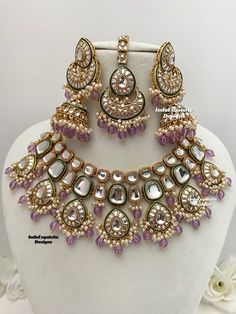 a necklace and earring set on display