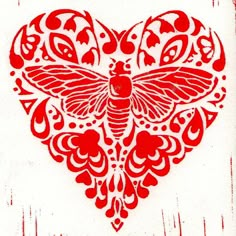 a red heart with a large butterfly on it's side and hearts in the middle