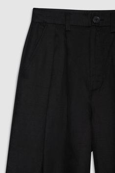 The Carrie Ankle Pant in black is a wide-leg trouser made from a light and breathable linen blend with a slight sheen. This ankle-length style features double-pleated front detailing, five functional belt loops, two back welt pockets, slanted front pockets, and a single button zip-front closure. The Carrie Ankle Pant is cut for a high-rise fit with a wide leg and ankle-length inseam. Take your true size. Black Ankle Pants, Belted Pants, Anine Bing, Ankle Length Pants, Cropped Trousers, Black Linen, Ankle Pants, Linen Pants, Welt Pockets