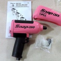 two pink hair dryers sitting next to each other on top of a white table