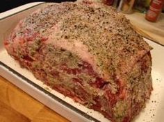 a large piece of meat sitting on top of a pan