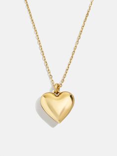 Design a special memento to represent those closest to your heart. The Puffy Heart 18K Gold Custom Pendant Necklace features a three-dimensional heart charm with the option to add 1-4 engraved letters of your choosing. Add the initials of each of the members of your family, you and a few loved ones, or even just your own - the options are endless. Better yet, this piece is crafted with 18K gold plated sterling silver, meaning it'll last you a lifetime. Gold Heart Pendant Necklace With Polished Finish, Silver Meaning, Heart Gold Necklace, Heirloom Necklace, Engraved Letters, Silver Braided Ring, Custom Pendant Necklace, Initial Jewelry Necklace, Puffy Heart Necklace