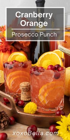 cranberry orange prosecco punch is served in glasses and garnished with cherries