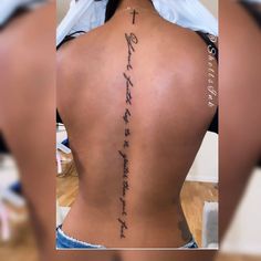 the back of a woman's lower back tattoo