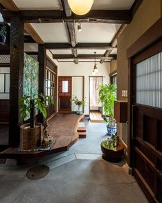 the inside of a house with potted plants