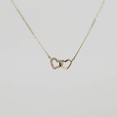 This 14k solid gold double interlocking heart necklace is perfect gift for anniversary, birthday or any special occasion to show someone you love them! DETAILS *** 14k solid yellow gold. *** Pendant dimension is 16mm x 8mm *** Necklace length is 16" to 18" adjustable. *** Total diamonds : 14 *** Total 0.21 ct weight *** Color GH ***Clarity SI ** All our raw materials are sourced from US-based companies for the quality and safety of our handmade products. ** All orders are elegantly packaged in s Gold Necklace For Girlfriend, Small Pendant Necklace Gold, 14k Gold Double Heart Fine Necklace, 14k Gold Double Heart Necklace, Gold Double Heart Sterling Silver Necklace, 14k Gold Double Heart Necklaces For Formal Occasions, 14k Gold Double Heart Necklace For Formal Occasions, Yellow Gold Double Heart Necklace For Mother's Day, 14k White Gold Double Heart Necklace