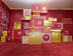 a red carpeted room with boxes and numbers on the wall