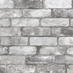 an old brick wall is shown in grey and white colors, as well as black and white