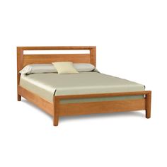 a wooden bed frame with white sheets and pillows on it's headboard, in front of a white background