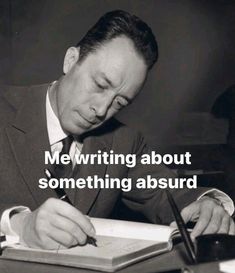 a man sitting at a desk writing on a book with the caption me writing about something