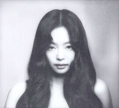 a black and white photo of a woman with long hair