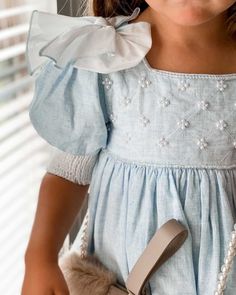 Petite Maison Kids "Charlotte" linen puff sleeve dress with faux pearls and clear hand beading     Square neckline    Short sleeves; bows at shoulders    Empire waist    Button closures at back; bow at waist    Hem falls below the knee    Ruffle trim    Cotton/linen/silk    Dry clean, hand wash    Imported Charlotte Baby, Blue Linen Dress, Luxury Clothing Brands, Petite Dresses, Childrens Fashion, Linen Dress