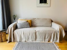 a living room with a couch and rug