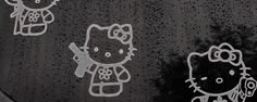 hello kitty stickers on the windshield of a car