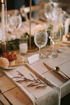 the table is set with place settings and silverware for guests to sit down at