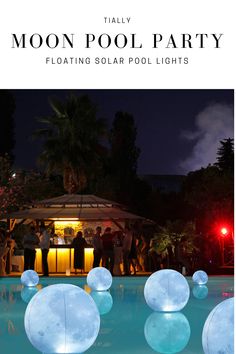 the moon pool party is set up with floating balls and lights for an outdoor event