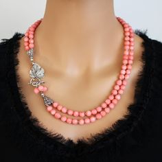 Pink Lariat Jewelry For Gifts, Coral Necklace With Lobster Clasp As Gift, Elegant Coral Round Bead Necklaces, Elegant Coral Gemstone Beaded Necklaces, Elegant Coral Beaded Necklaces, Elegant Coral Beaded Necklaces With Gemstone, Elegant Coral Necklaces With Gemstone Beads, Elegant Double Strand Coral Necklace, Elegant Pink Gemstone Beaded Necklaces