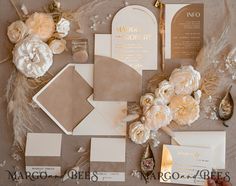 the wedding stationery is laid out and ready to be put into the bride's bouquet