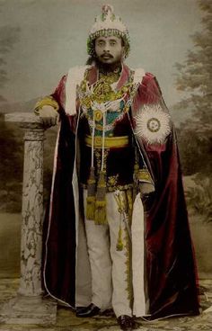 an old photo of a man dressed in costume