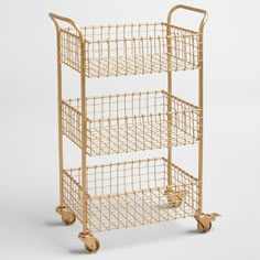 a three - tiered metal cart with wheels on the front and bottom, in gold