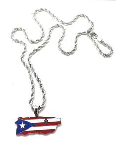 "What a beautiful piece to wear and know that you are always praying for the wellbeing of Puerto Rico. The island has the Puerto Rican Flag mopped with Red, White and Blue colors in front. In the back of the pendant, you have the cross and the words \"God Bless Puerto Rico\" lasered. The cross is carved through the pendant and can be seen on both sides front & back. Pendant comes with a 24\"-inch stainless steel Rope style chain." Puerto Rican Flag, Porto Rico, Puerto Rican, Red White And Blue, God Bless, Puerto Rico, Necklace Etsy, Jewelry Necklace Pendant, Red White