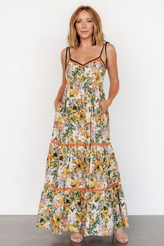 It's giving summer! Check out our Pierrette Maxi Dress in Tangerine Multi, featuring gorgeous floral print, adjustable self-tie spaghetti straps, functional side pockets, and more! Baltic Born, Tiered Maxi Skirt, Cup Size, Online Shopping Clothes, Empire Waist, Smocking, Maxi Skirt, Spaghetti Strap, Floral Print