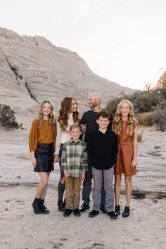 a family posing for a photo in the desert