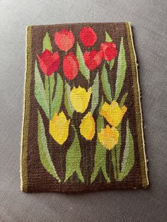 a piece of cloth with flowers painted on it