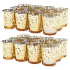 set of twelve gold and silver glass votives with speckles on them