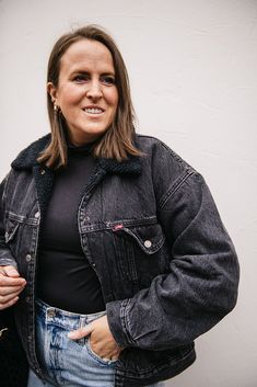 A Levi's Trucker Jacket makes an outfit. You'd be hard-pressed to find a jacket with an easier shape, more versatile weight or inherent sense of cool. Bonus: This throwback cut features a pitched silhouette for a distinctly ‘90s feel and is lined with ultra cozy sherpa. Button front closure Side pockets Oversized fit (Linda is wearing a medium) 12% recycled cotton, 88% cotton Black Sherpa Jean Jacket Outfit, Sherpa Jean Jacket Outfit, Black Jean Jacket Outfit, Sherpa Jean Jacket, Black Jean Jacket, Jean Jacket Outfits, Black Levis