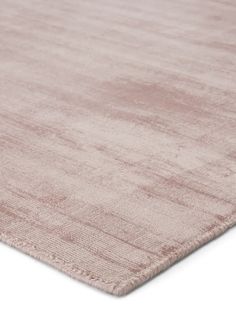 an area rug with a light pink color on the top and bottom part of it