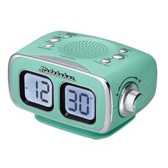 an alarm clock radio with the time displayed on it's display and two dials