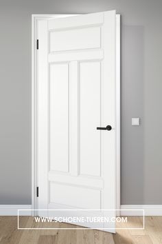 an open white door in a room with wood floors and gray walls, showing the bottom panel