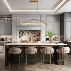 an elegant kitchen with marble counter tops and gold accents, along with bar stools