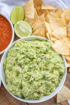 a bowl of guacamole with chips and salsa