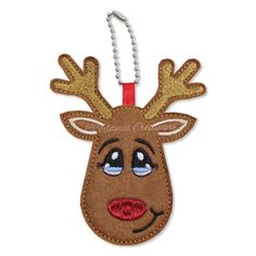 a keychain with a reindeer head on it's face and red nose