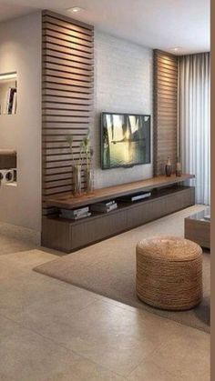 a living room filled with furniture and a flat screen tv on top of a wall