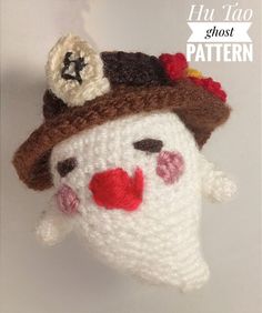 a crocheted snowman ornament with a hat on it's head