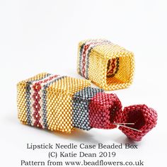 two beaded boxes sitting next to each other on a white surface with the words lipstick needle case beaded box written below them