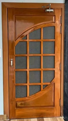 a wooden door with glass inserts on it