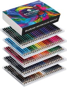 a box of watercolor pencils with different colors and sizes in it on a white background